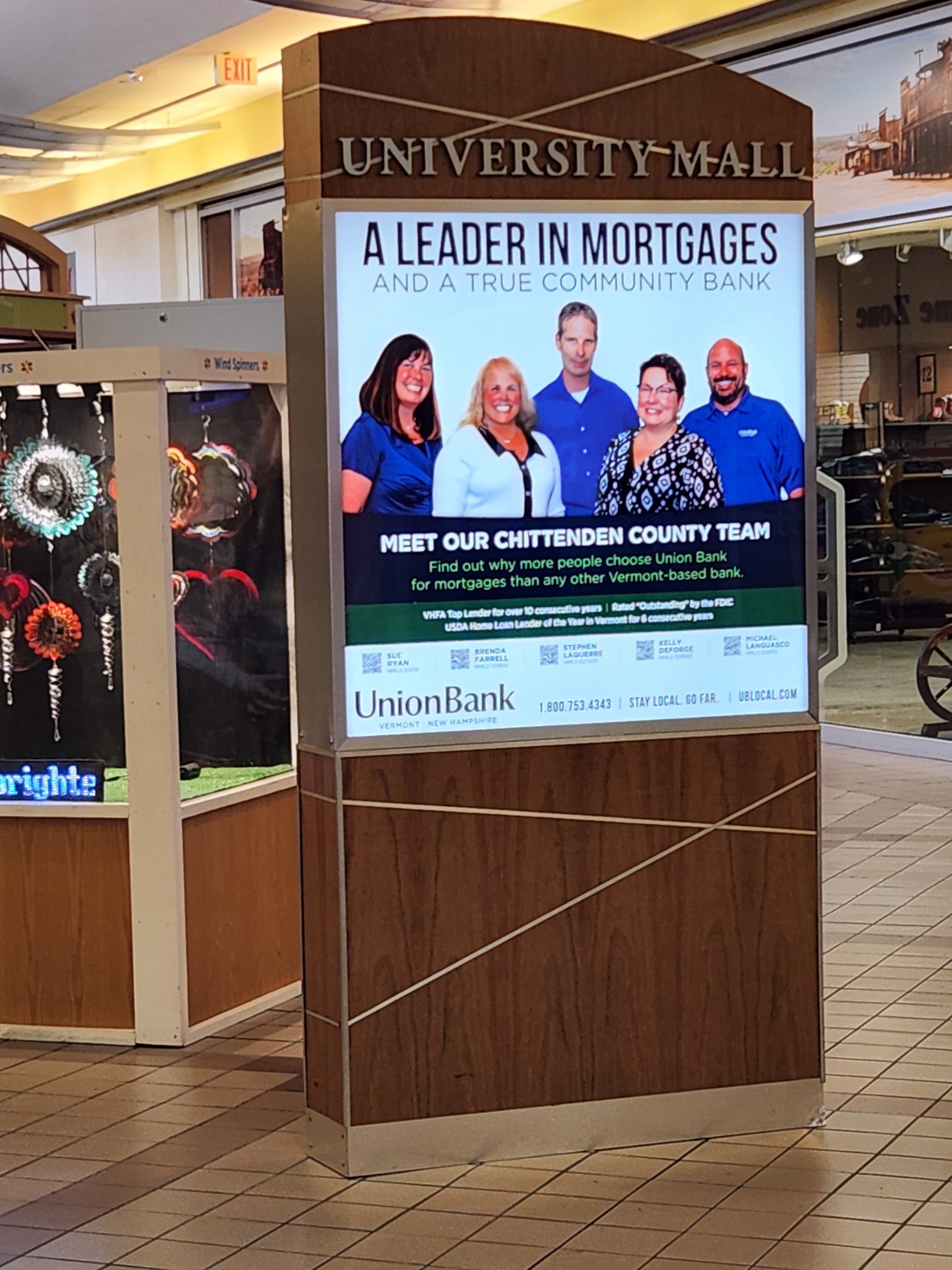 Vertical digital advertising display inside University Mall