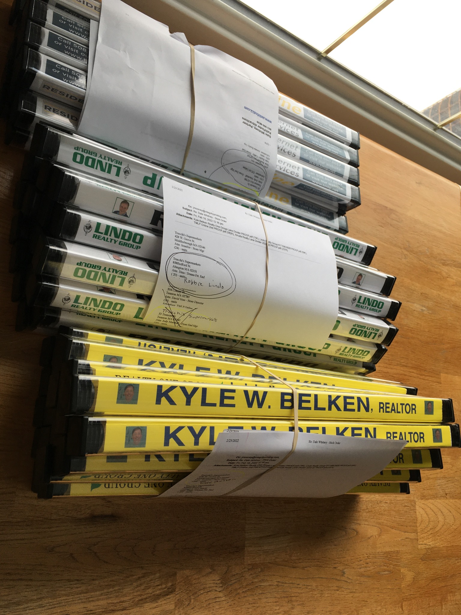 Stack of completed branded checkout dividers