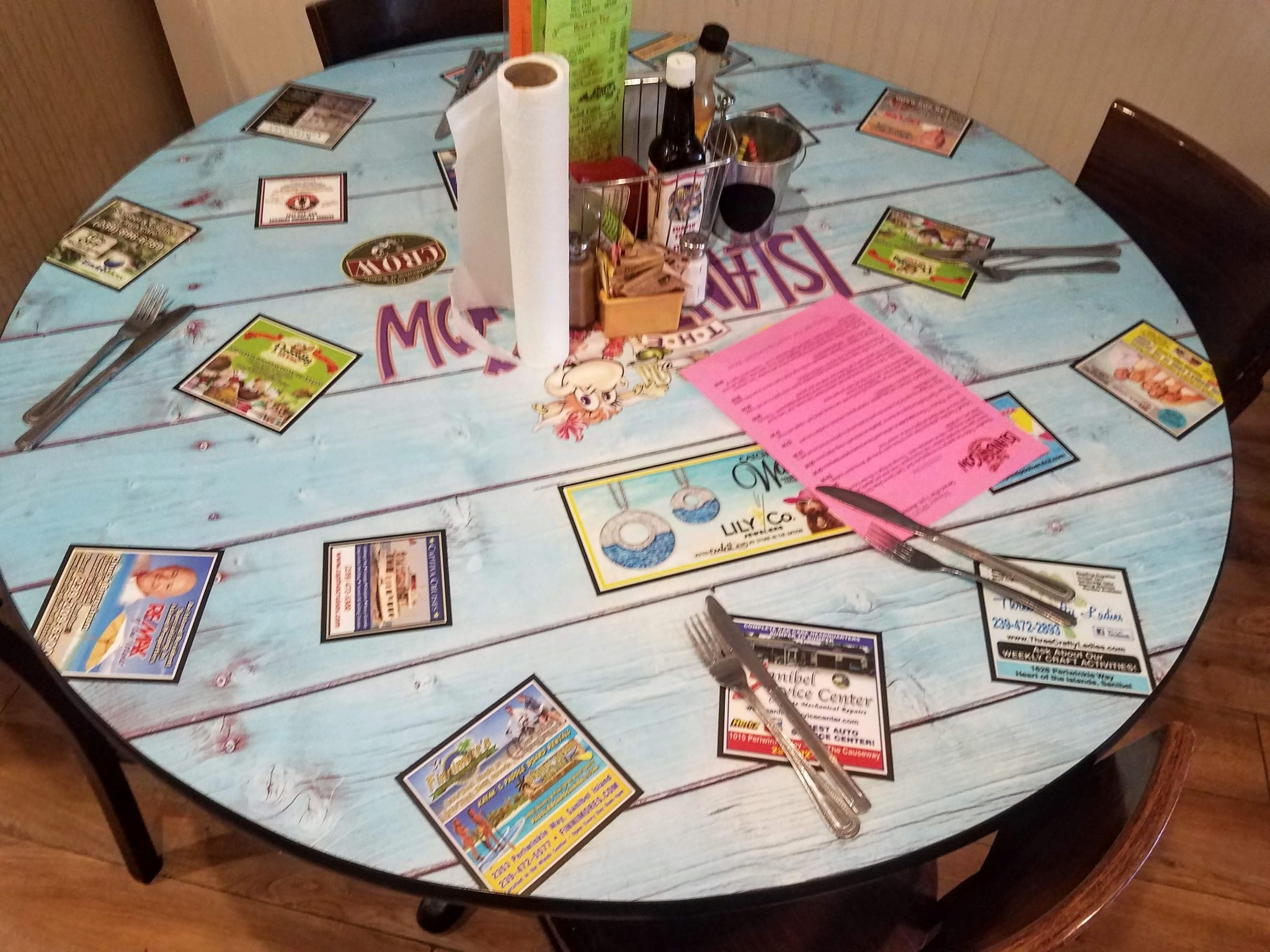 Installed round tabletop featuring local business advertisements