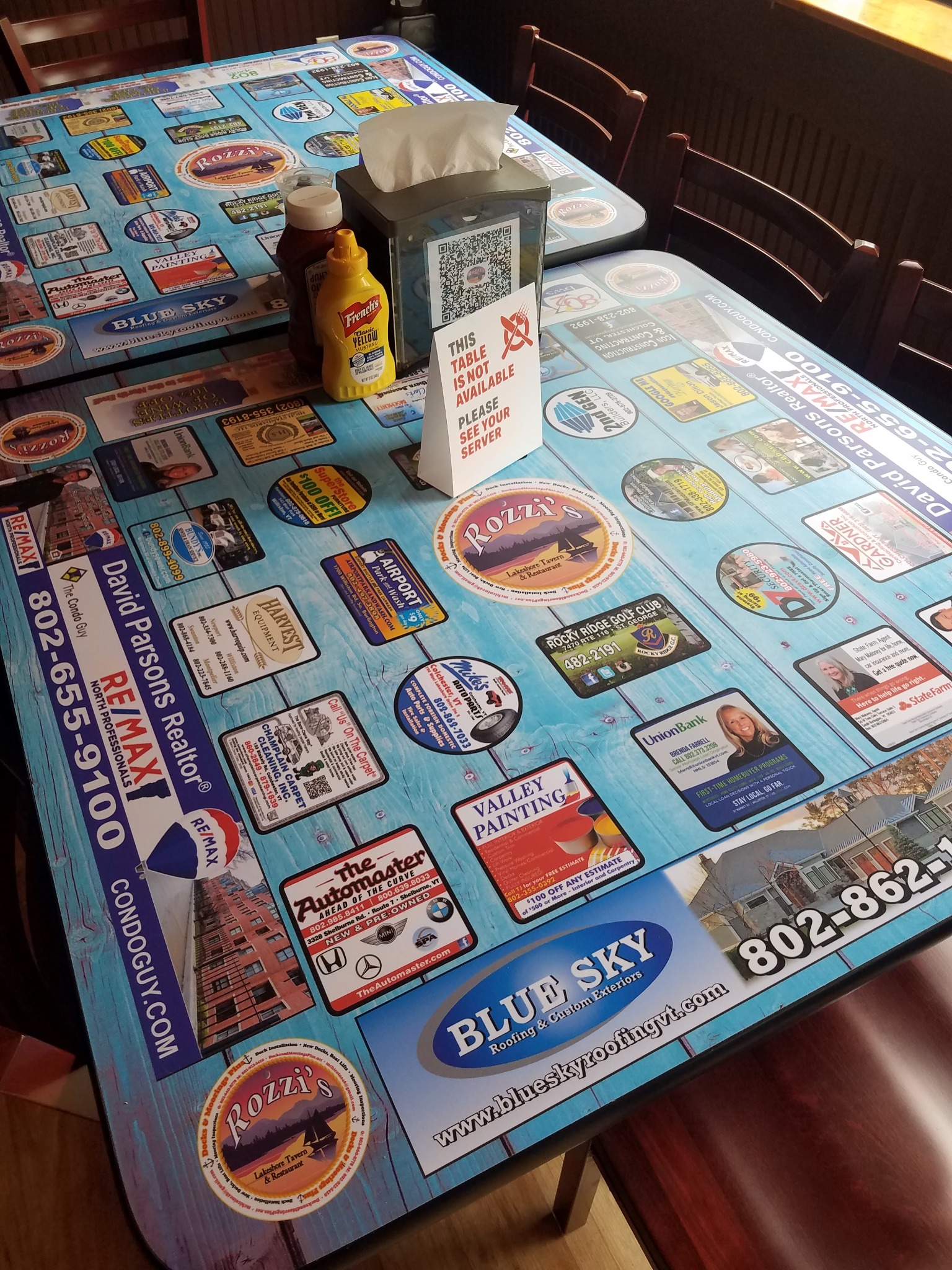 Close-up view of blue advertising tabletops in a restaurant